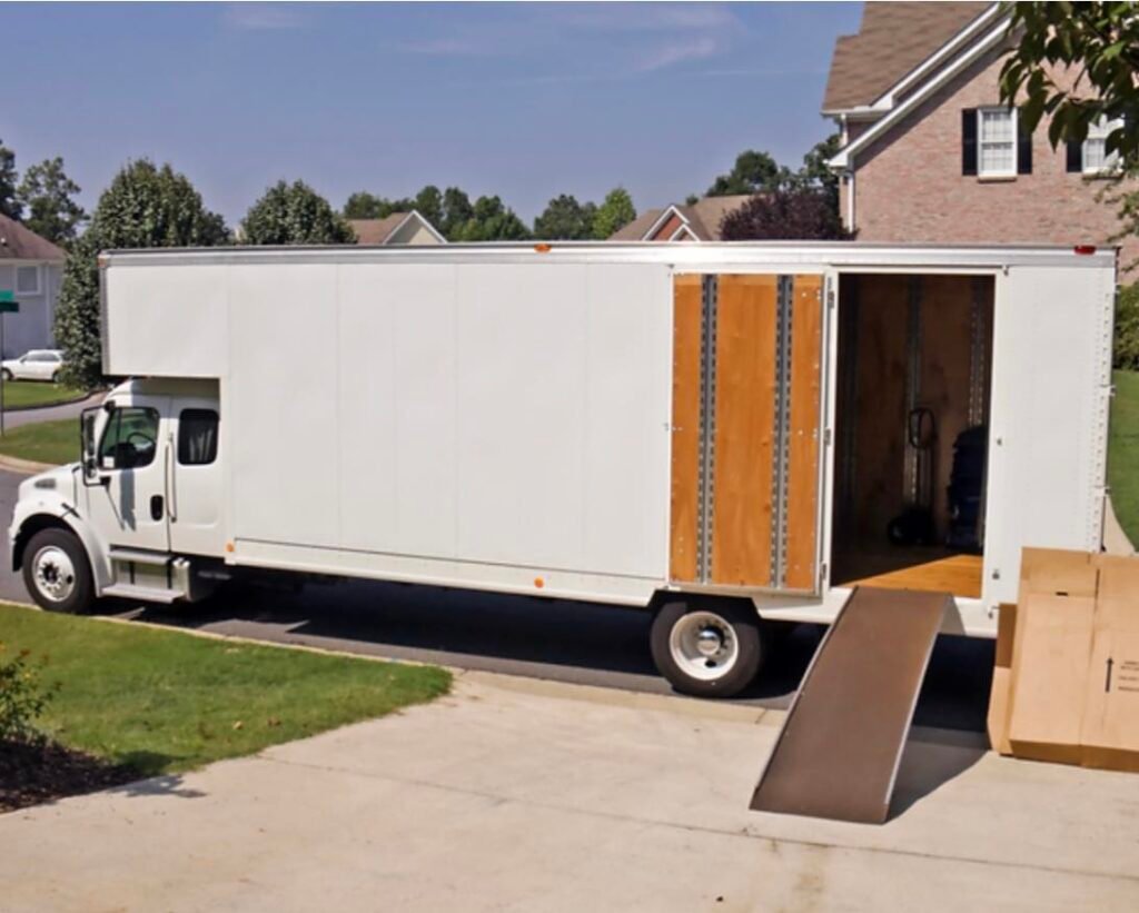 Company truck parked outside a home during a residential move.